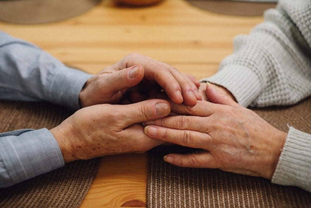 hands embracing in comfort
